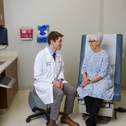 Maryland Proton Treatment Center - Dr. Molitoris with a patient in an exam room