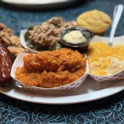 Miss Delta Restaurant and Bar - Candied yams, cheese grits, collard greens w/pulled pork, cornbread, andouille sausage, and two fried oysters
