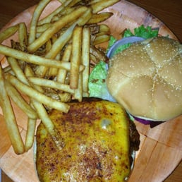 The cajun burger and fries. The cajun burger and fries.