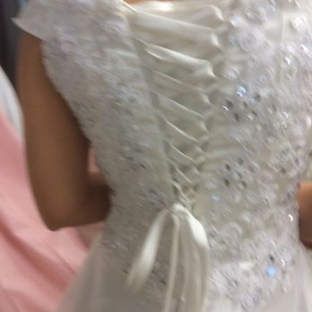 Bridals By Nancy Tailoring & Alterations - Nancy noticed that the lining along the top was too high. She tailored it to be more flattering (shown here) - Bridal Near Me - Houston, Texas Bridals By Nancy Tailoring & Alterations - Nancy noticed that the lining along the top was too high. She tailored it to be more flattering (shown here) - Bridal Near Me - Houston, Texas