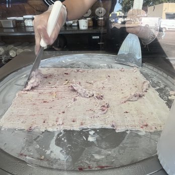 Dreams Rolled Ice Cream - The process of spreading the icecream and freezing it, before rolling with spatula scraper - Food Trucks Near Me - Springfield, Oregon Dreams Rolled Ice Cream - The process of spreading the icecream and freezing it, before rolling with spatula scraper - Food Trucks Near Me - Springfield, Oregon