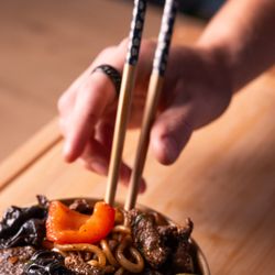 Vostok - Wok Lagman - hand-pulled fried noodles with beef, bell peppers, onions, and spices
