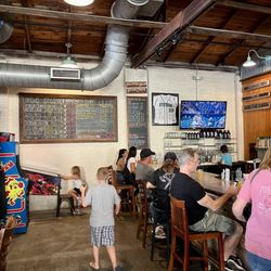 Persimmon Hollow Brewing - Current beer selection on wall Family-friendly, dog-friendly, food-friendly