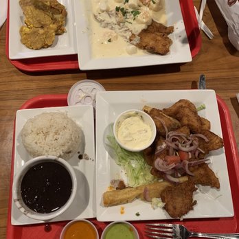 La Granja - Fried fish with shrimp and scallops , sides of fried plantains. - Peruvian Near Me - Miami, Florida La Granja - Fried fish with shrimp and scallops , sides of fried plantains. - Peruvian Near Me - Miami, Florida