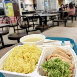 Hainanese chicken with oil rice and included chicken soup $13. 海南雞飯