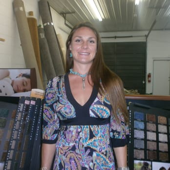 Norton Flooring - a woman standing in a showroom - Flooring Near Me - Sharonville, Ohio Norton Flooring - a woman standing in a showroom - Flooring Near Me - Sharonville, Ohio