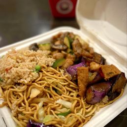 Bigger Plate with mushroom chicken, tofu & eggplant and extra chow mien (in the background)