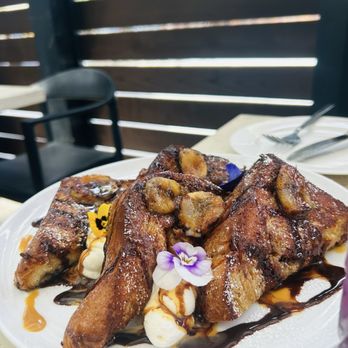Benchmark - DULCE DE LECHE FRENCH TOAST, crème fraîche chantilly, brûléed banana, chocolate sauce, maldon salt - New American Near Me - Santa Ana, California