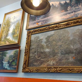 Taco Billy Black Mountain - Wall art with like orange goats added to all the paintings - Tacos Near Me - Black Mountain, North Carolina