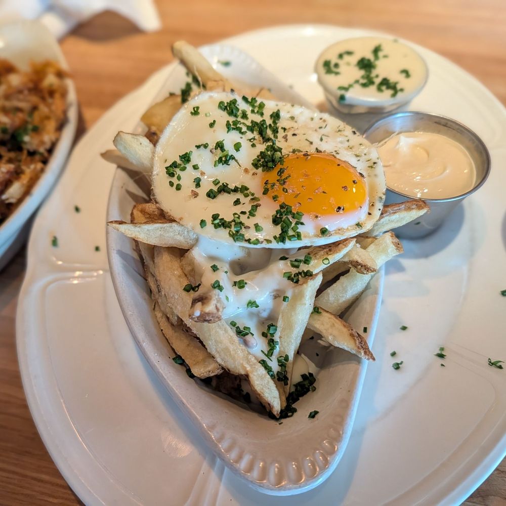 Au Cheval - Fries with mornay sauce and fried egg - Bars Near Me - Chicago, Illinois Au Cheval - Fries with mornay sauce and fried egg - Bars Near Me - Chicago, Illinois