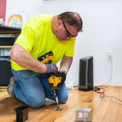 K-CO Electric - K-CO Electric technician installing a floor-mounted outlet box during an interior electrical upgrade.