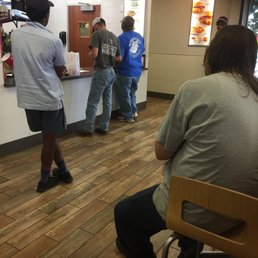 a group of people in a fast food restaurant a group of people in a fast food restaurant