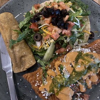 The Spanish Traveler - Tostada, taquito, and empanada combo plate - Mexican Near Me - Pewaukee, Wisconsin The Spanish Traveler - Tostada, taquito, and empanada combo plate - Mexican Near Me - Pewaukee, Wisconsin