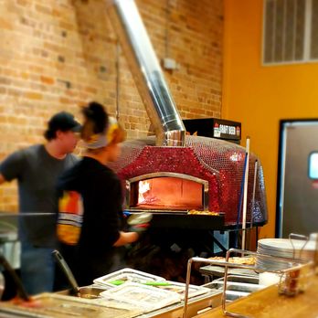 Zander's Woodfired Pizza - two people working in a kitchen - American Near Me - Dickson, Tennessee Zander's Woodfired Pizza - two people working in a kitchen - American Near Me - Dickson, Tennessee