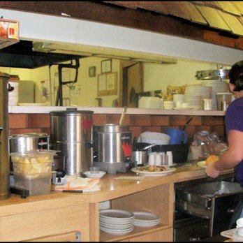 Wagon Wheel Restaurant - My friendly server, Sam gets ready to hand my breakfast to me, as she's just received it from the kitchen. - American Near Me - Needles, California Wagon Wheel Restaurant - My friendly server, Sam gets ready to hand my breakfast to me, as she's just received it from the kitchen. - American Near Me - Needles, California