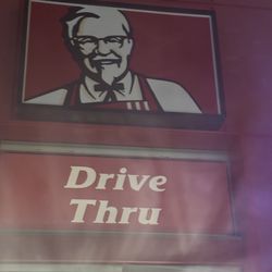 KFC - Drive-through sign featuring the Colonel Sanders.