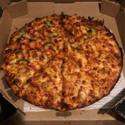 Domino's Pizza - This was a pan pizza well done with half chicken and half green peppers.
