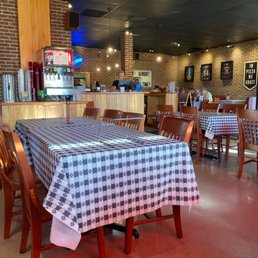 a restaurant with a checkered table cloth
