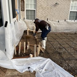 Mickey Construction - Building up the steps that come off of the sunroom. Patio addition is next to be poured.