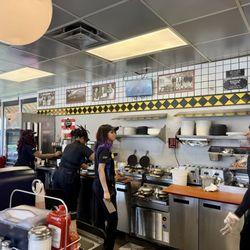 Waffle House - Back bar with a very busy and well coordinated team working hard