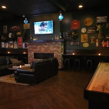 Back Game Room With Couches Tabletop Shuffleboard Foosball And