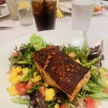 The Capital Grille - Seared Citrus Glazed Salmon with Mango, tomato's and citrus vinaigrette. - Steakhouses Near Me - Rosemont, Illinois The Capital Grille - Seared Citrus Glazed Salmon with Mango, tomato's and citrus vinaigrette. - Steakhouses Near Me - Rosemont, Illinois