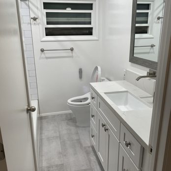 Quest Preservation - a bathroom with a toilet and sink - General Contractors Near Me - Orange, California