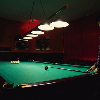 Russian billards - a man playing a game of pool - Pool Halls Near Me - Chicago, Illinois Russian billards - a man playing a game of pool - Pool Halls Near Me - Chicago, Illinois