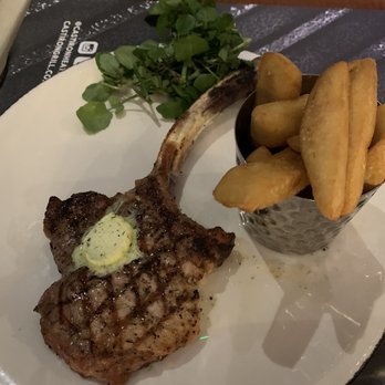 Cast Iron Bar & Grill - Tomahawk Pork Steak - British Near Me - London, XGL Cast Iron Bar & Grill - Tomahawk Pork Steak - British Near Me - London, XGL