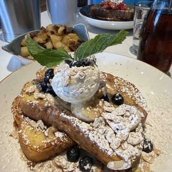 First Watch - Banana brittle french toast with seasoned potatoes - Breakfast & Brunch Near Me - Henderson, Nevada First Watch - Banana brittle french toast with seasoned potatoes - Breakfast & Brunch Near Me - Henderson, Nevada