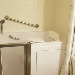 a bathroom with a toilet and bathtub
