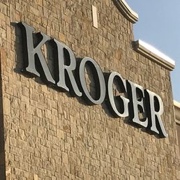 a kroger sign on a brick building a kroger sign on a brick building