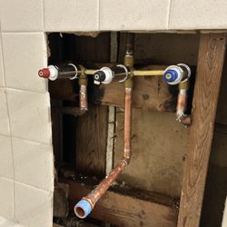A & D Plumbing Services - New three handle shower valve installed for a tenant to restore hot water