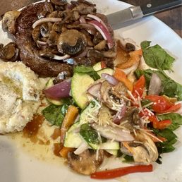 Ribeye steak loaded with onions and mushrooms. Ribeye steak loaded with onions and mushrooms.