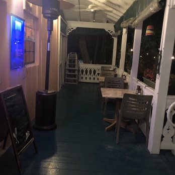 Key Largo Conch House - Seating on porch - Seafood Near Me - Key Largo, Florida