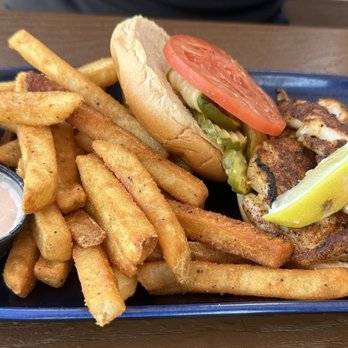 Caribbean Jack's - Blackened jumbo fish sandwich with fries - Caribbean Near Me - Daytona Beach, Florida