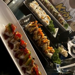 Dragon roll, spider roll, salmon maki and the perfect fire ocean roll Dragon roll, spider roll, salmon maki and the perfect fire ocean roll