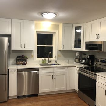 Benchmark Home Improvements - a kitchen with stainless steel appliances - General Contractors Near Me - Newmarket, New Hampshire Benchmark Home Improvements - a kitchen with stainless steel appliances - General Contractors Near Me - Newmarket, New Hampshire
