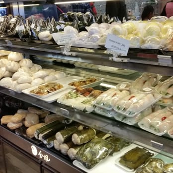 Cha Kim Phung - A variety of buns, Cha (cured meat rolled in banana leaf), Cai Guon (spring rolls with dipping sauce), cookies and sesame balls to go. - Delis Near Me - Falls Church, Virginia
