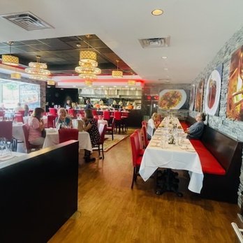 Oak & Ember Steakhouse - Full dining room with a peak into the kitchen. - Steakhouses Near Me - Stuart, Florida Oak & Ember Steakhouse - Full dining room with a peak into the kitchen. - Steakhouses Near Me - Stuart, Florida