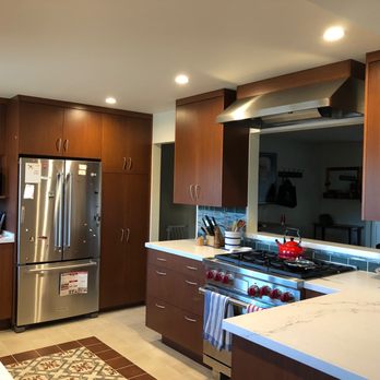 Ron Cohen - Stove, window cut out in wall, vent hood with custom trim to match cabinets - General Contractors Near Me - San Carlos, California