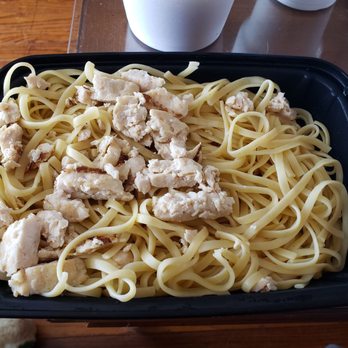 Avantis - a plate of pasta with chicken on it - Italian Near Me - Peoria, Illinois