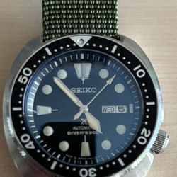 Cote Timeworks - Seiko bezel, domed sapphire crystal, and sword hand modifications.