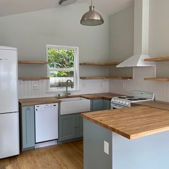Gonzalez Construction - a kitchen with white appliances and wood countertops - General Contractors Near Me - Fort Bragg, California Gonzalez Construction - a kitchen with white appliances and wood countertops - General Contractors Near Me - Fort Bragg, California