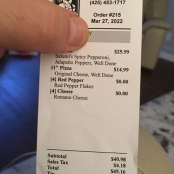 Pagliacci Pizza - a person holding a receipt - Pizza Near Me - Kirkland, Washington
