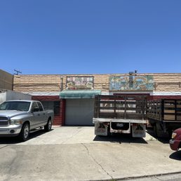 two trucks parked in front of a building