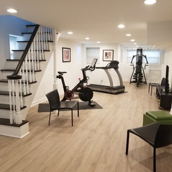 Sameer Construction - a home gym with equipment - General Contractors Near Me