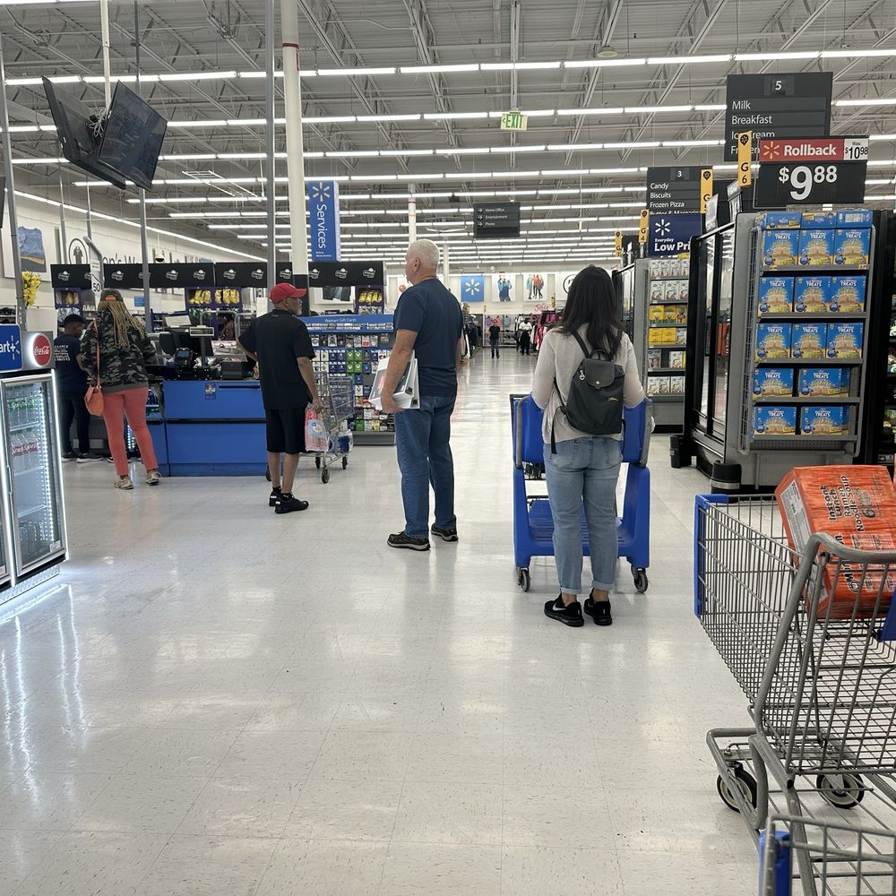 Self checkout line BEFORE most of the registers were turned on Self checkout line BEFORE most of the registers were turned on