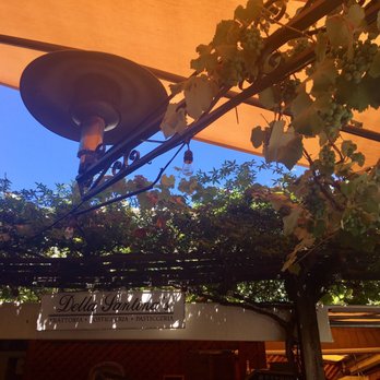 Della Santina's - Grape vines overhead on the back patio. - Italian Near Me - Sonoma, California