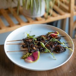 Bar Asra - Tender chicken skewers marinated with garlic ash, yoghurt and
ginger, grilled to perfection & served with lemon aioli.
